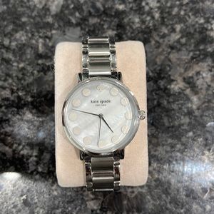 Used Kate Spade watch. Shows signs on wear. Needs a new battery